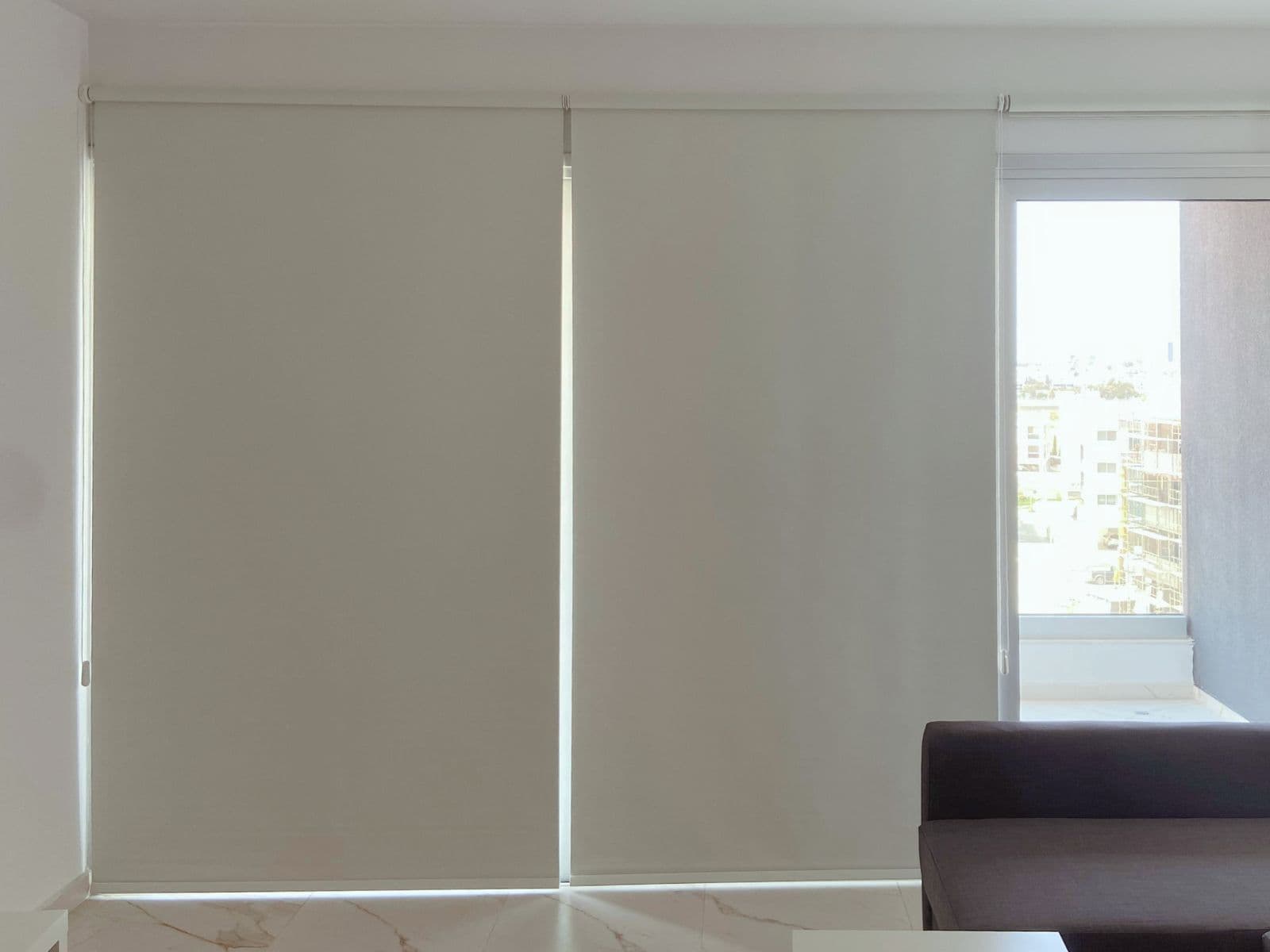 Modern interior blinds filtering daylight in a bright room